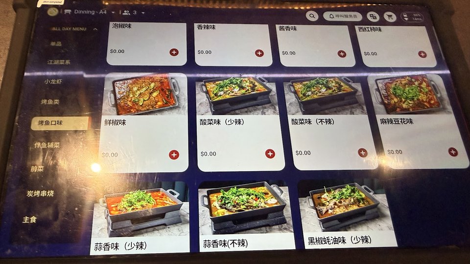 Colorful plates of fish, skewers, and noodles.