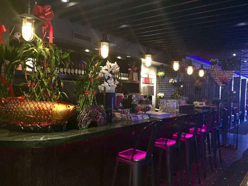 Spicy Sichuan dishes on a restaurant table.